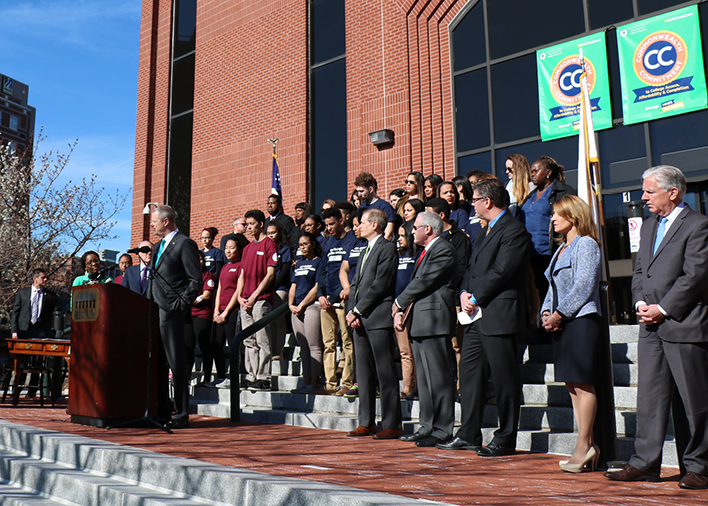 Governor Baker announces the Commonwealth Commitment agreement in a crowd of hundreds on the steps of Middlesex Community College