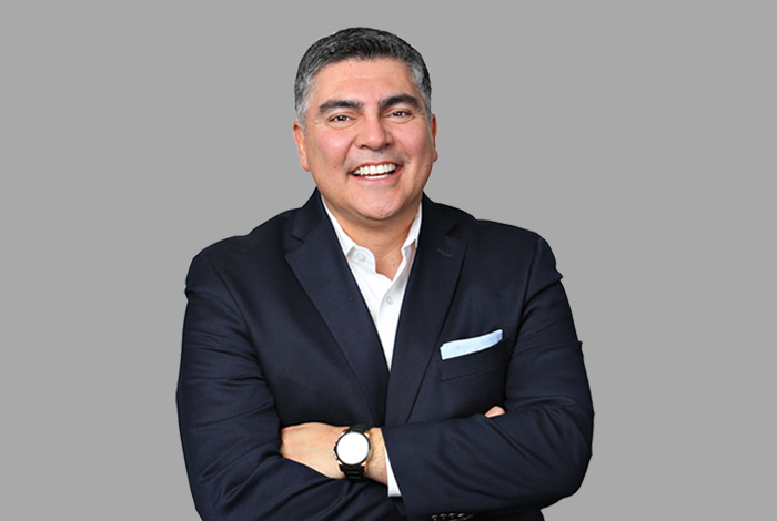 Headshot of Interim Commissioner José Luis Santos