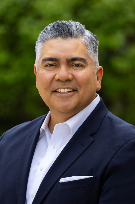 Headshot of Interim Commissioner Santos